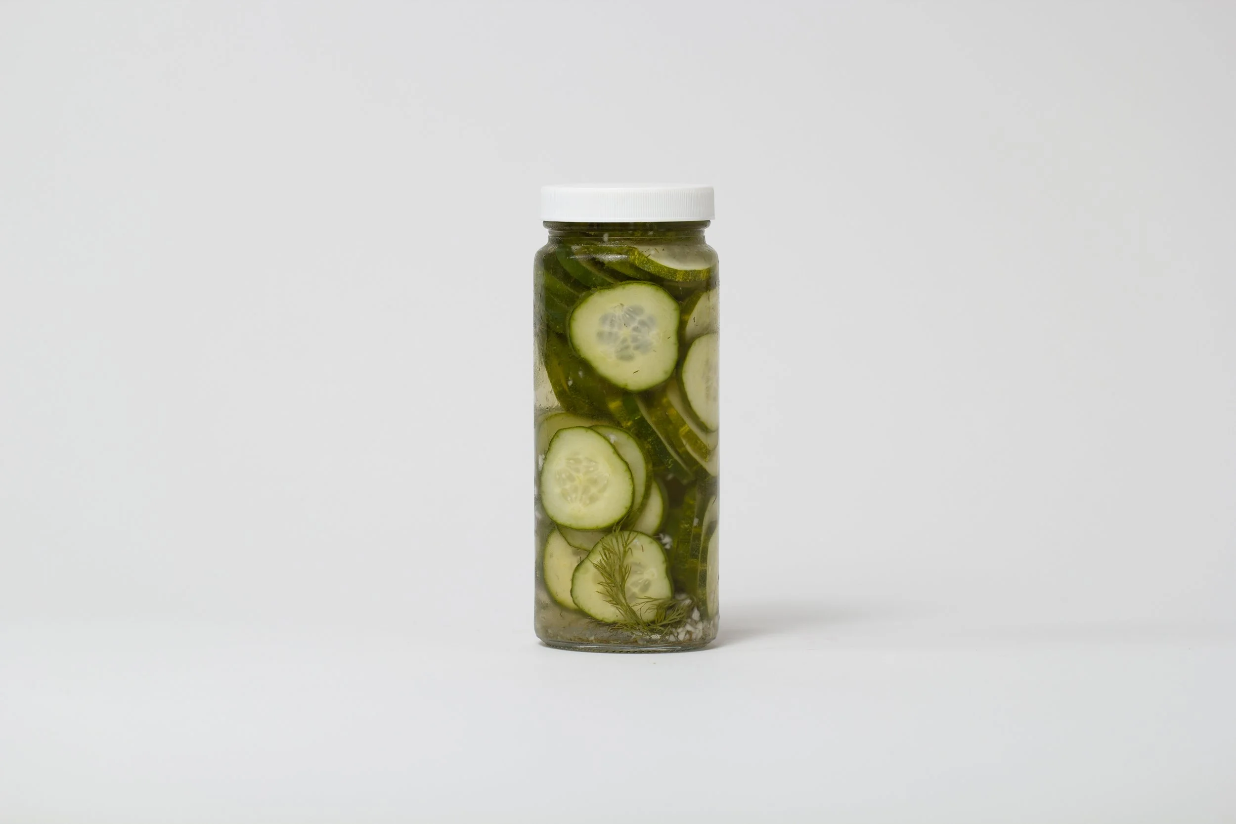 Babes Pickles jar photographed with food and ingredients